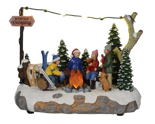 PERSONAGGI IN POLIRESINA SCIATORI CON FUOCO H.14,5X21X12CM